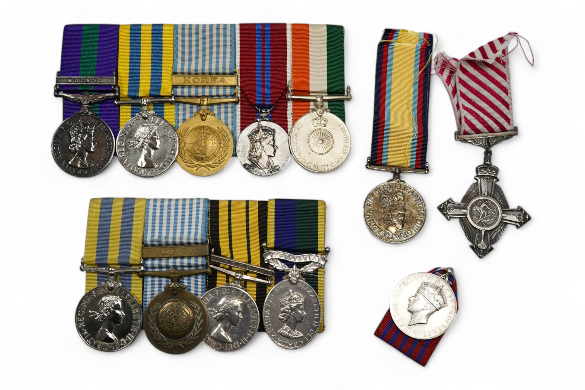 Twelve ERII and George VI medals, some medals arranged into two medals groups (containing unnamed medals and medals awarded to different recipients within the same group), including